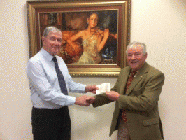 President John Hicks presents a cheque for ï¿½200 to John Davies from the Royal Wootton Bassett Arts Festival.